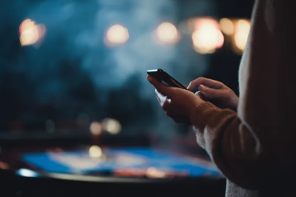 A glowing roulette wheel with cascading chips, symbolizing the engaging live and instant-win games available on HI76.