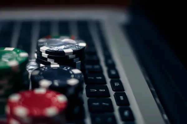 HI76 Jackpot Slots — Spin for massive rewards A dramatic shot of winning sevens landing on a slot reel surrounded by shining gold coins, symbolizing big wins.